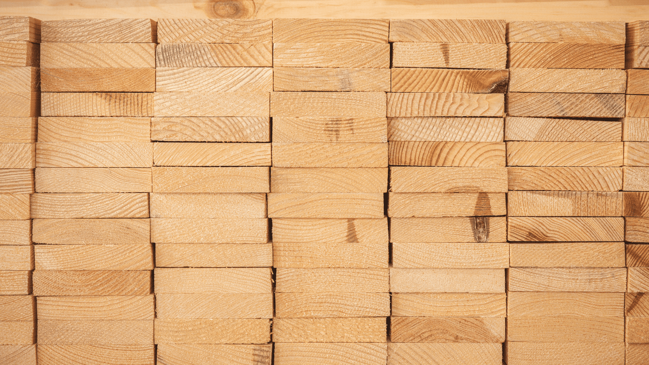 Stack of engineered wood dimensional lumber 2x4s.