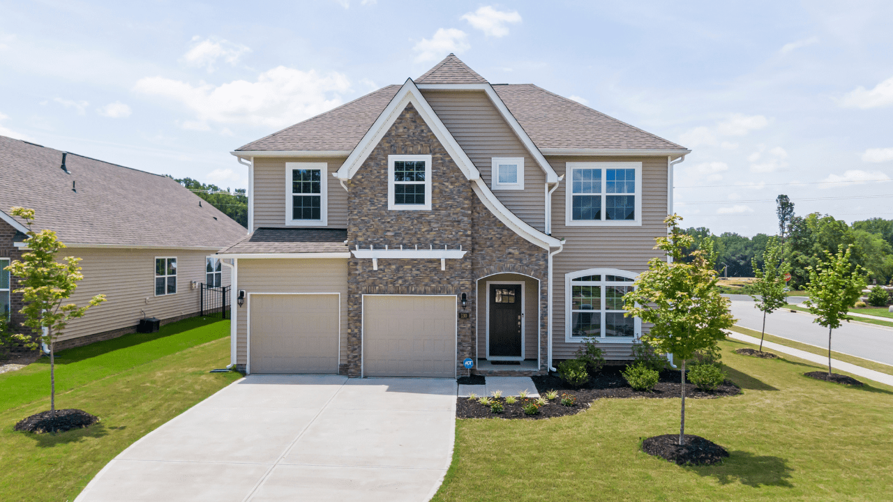 Exterior of suburban home with tan siding.