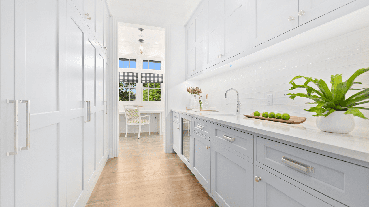 Modern kitchen installed with white cabinetry