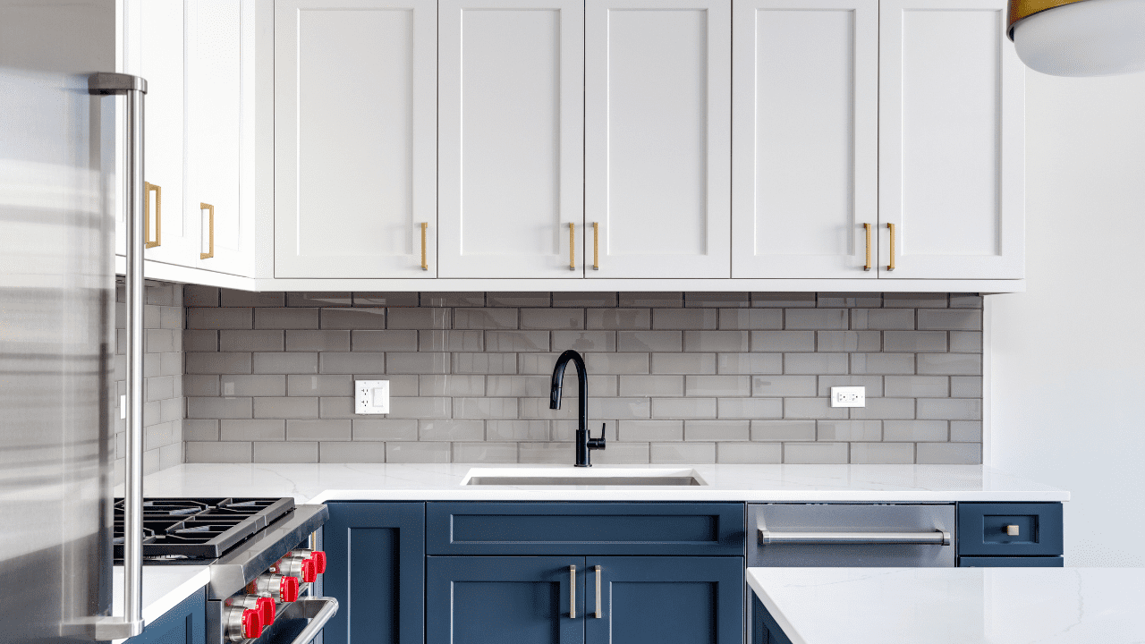 Kitchen With White and Navy Blue Cabinetry