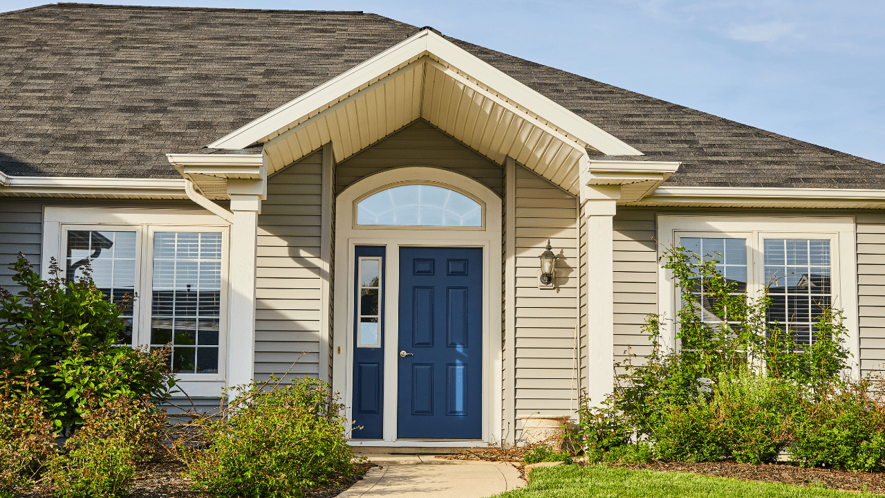 Modern traditional home with eye catching blue front door.