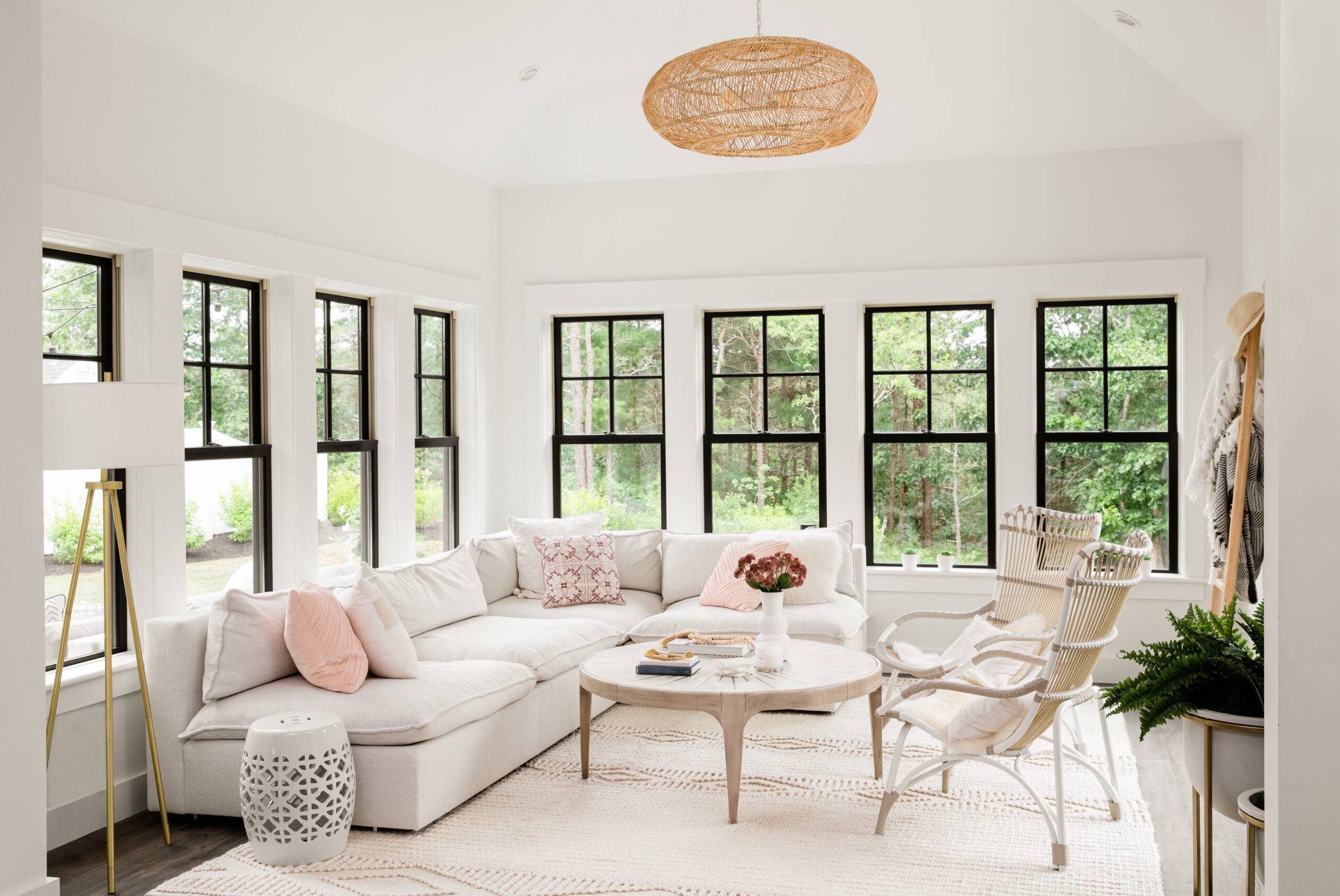 Home interior white living room with side by side double hung sliding windows.