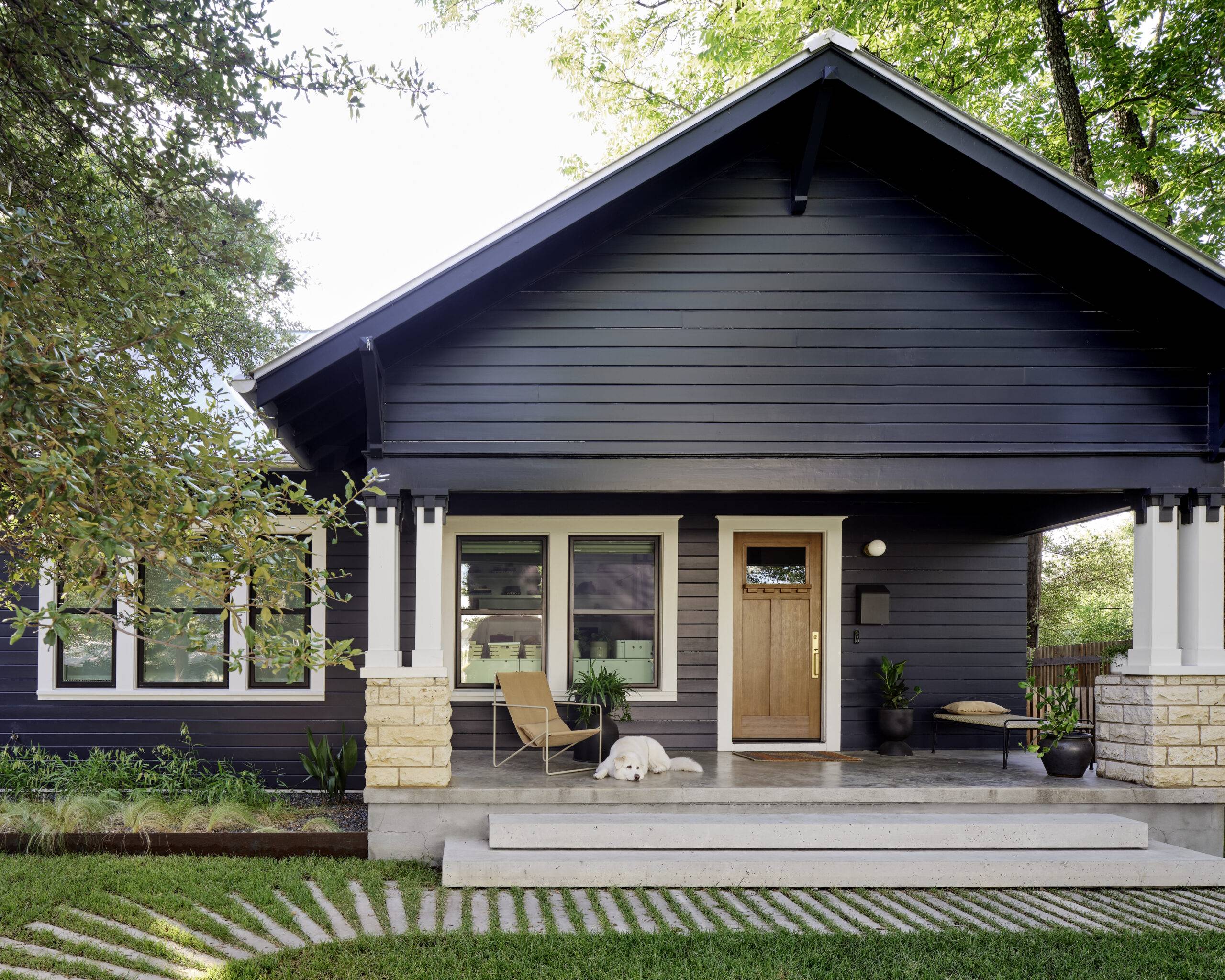 New home build front of navy and creme colored single family home.